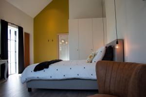 Postel nebo postele na pokoji v ubytování Madelette B&B