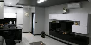Kuchyňa alebo kuchynka v ubytovaní Apartament Lema Versace