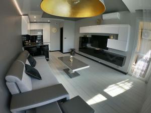 Kuchyňa alebo kuchynka v ubytovaní Apartament Lema Versace