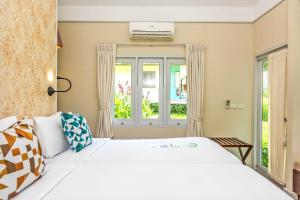 Postel nebo postele na pokoji v ubytování Sai Kaew Beach Resort + 37 fotografií