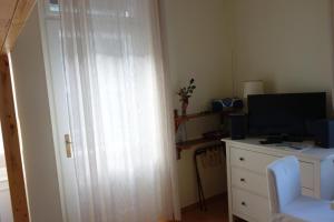 Televízia a/alebo spoločenská miestnosť v ubytovaní Executive Apartement Gastein