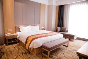 Postel nebo postele na pokoji v ubytování Metropark Hotel Yingkun Beijing
