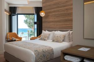 Postel nebo postele na pokoji v ubytování Seasabelle Hotel near Athens Airport + 37 fotografií