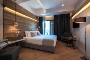 Voodi või voodid majutusasutuse Seasabelle Hotel near Athens Airport toas
