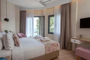 Voodi või voodid majutusasutuse Seasabelle Hotel near Athens Airport toas