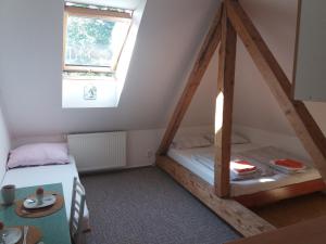 Postel nebo postele na pokoji v ubytování Apartmány F-M
