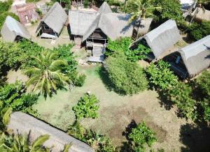 an aerial view of a house with trees and plants at Anastasea, Palm Tree Garden Lodging in Praia do Tofo