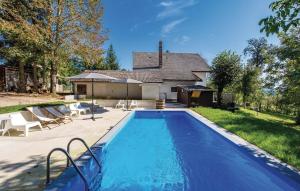 a swimming pool in front of a house at House Sara in Latin