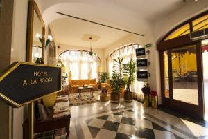 a hotel lobby with a hotelallala road sign in a store at Alla Rocca Hotel Conference & Restaurant in Bazzano Bologna
