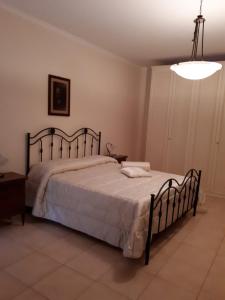 Ένα ή περισσότερα κρεβάτια σε δωμάτιο στο B&B Porta del Gargano
