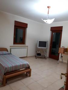 TV a/nebo společenská místnost v ubytování B&B Porta del Gargano