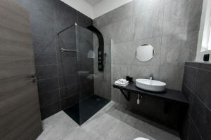 a bathroom with a sink and a shower at Margot Fiera Verona in Verona