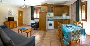 A kitchen or kitchenette at Apartamentos Rurales El Prado