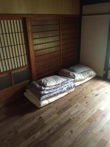 מיטה או מיטות בחדר ב-Kumano Winery Guest House