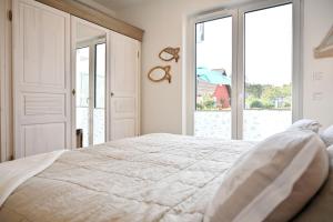 Postel nebo postele na pokoji v ubytování Ferienwohnung Strandgut