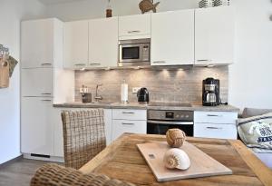 Kuchyň nebo kuchyňský kout v ubytování Ferienwohnung Strandgut + 10 fotografií