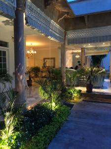 a house with a courtyard with plants and lights at The Rohet House in Jodhpur
