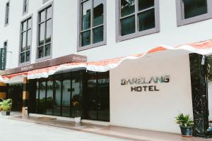 a building with the entrance to a catering hotel at Barelang Hotel Nagoya Batam in Nagoya