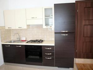 Kuchyň nebo kuchyňský kout v ubytování Apartments & Room Masa + 24 fotografií