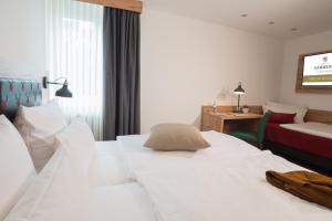 Postel nebo postele na pokoji v ubytování Hotel Kammerer