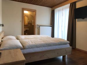 Postel nebo postele na pokoji v ubytování Platzerhof