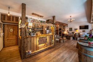 a bar with wooden walls and wooden floors at DaSte' ex Villa Ruggero in Campitello di Fassa +109 photos