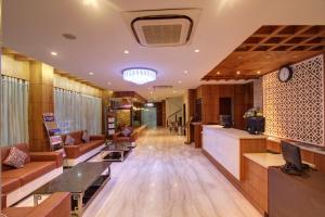 a lobby of a hospital with a waiting room at Hotel Prince Gardens in Coimbatore