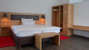 Postel nebo postele na pokoji v ubytování Hotel Kammerer