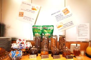 a table with a bunch of different types of food at Hotel Franklin Feel The Sound in Rome