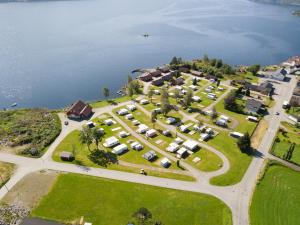 an aerial view of a resort with the water at Sauda Fjord Camping in Saudasjøen