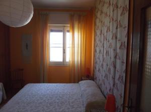 Postel nebo postele na pokoji v ubytování I Tetti Di Sassari B&B