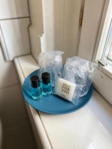 a blue plate with some items on a table at Appartment Stadtgarten in Tuttlingen