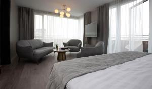 Ένα ή περισσότερα κρεβάτια σε δωμάτιο στο Midtown Hotel
