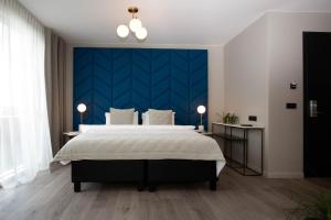 Ένα ή περισσότερα κρεβάτια σε δωμάτιο στο Midtown Hotel