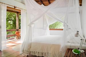 Cama ou camas em um quarto em O Sitio - Ilha Grande