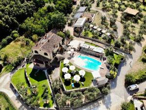 an aerial view of a house with a swimming pool at Podere Del Griccia in Civitella in Val di Chiana