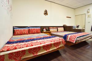 Postel nebo postele na pokoji v ubytování Xi Cun Homestay