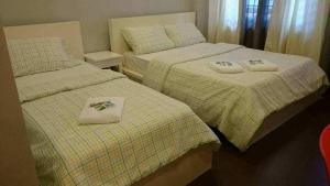 Voodi või voodid majutusasutuse GLC SUITES toas