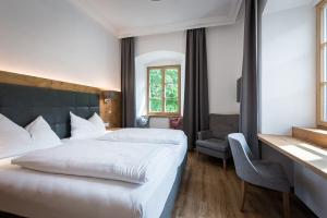 Voodi või voodid majutusasutuse Hotel Plankenhof B&B toas