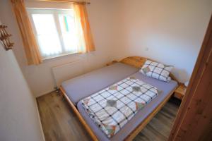 Кровать или кровати в номере Ferienhaus Kühlwein