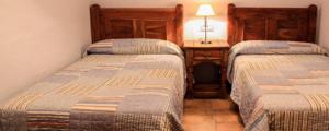A bed or beds in a room at Alojamientos rurales el hosquillo, lugar de bienestar