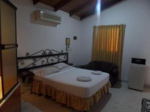 Cama o camas de una habitación en Aparta Hotel Plaza Real Norte