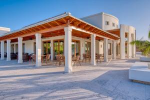 a pavilion with tables and chairs on a patio at Las Verandas Hotel & Villas in First Bight