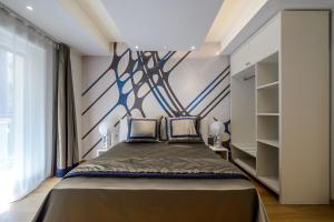 Postel nebo postele na pokoji v ubytování Quarto Novo Suite
