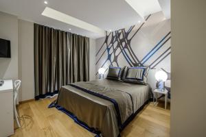 Postel nebo postele na pokoji v ubytování Quarto Novo Suite