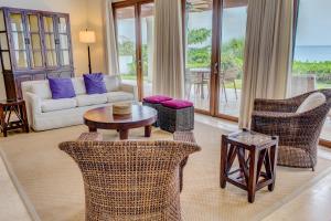 a living room with a couch and chairs and a table at Las Verandas Hotel & Villas in First Bight