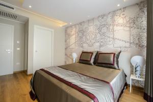 Postel nebo postele na pokoji v ubytování Quarto Novo Suite