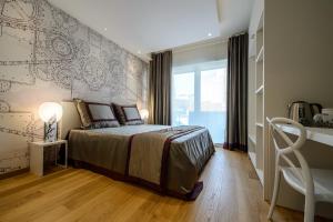 Postel nebo postele na pokoji v ubytování Quarto Novo Suite