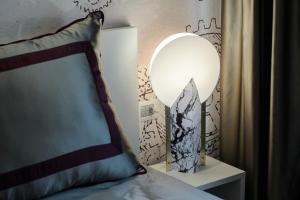Postel nebo postele na pokoji v ubytování Quarto Novo Suite
