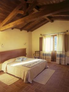 Säng eller sängar i ett rum på Hotel Giardino Corte Rubja